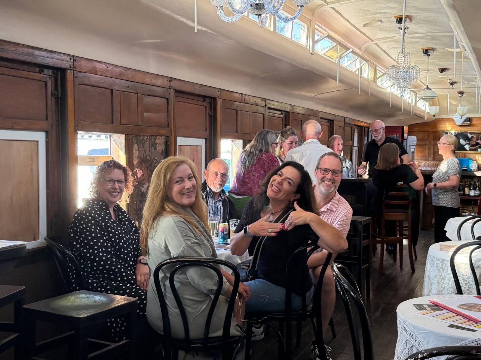 Friends gathering inside the restored PAVED festival carriage