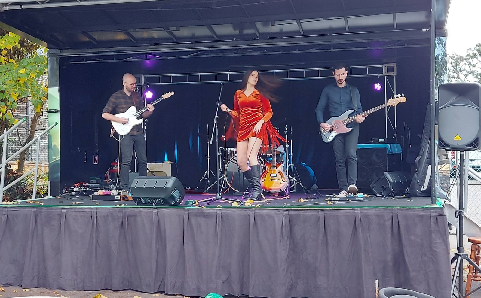 Band performing live on stage at PAVED Festival